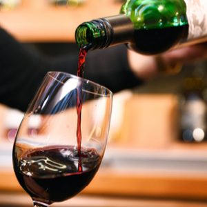 Close-up of red wine being poured into a glass