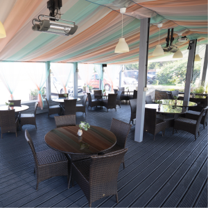 The Falcon's Marquee with a beautiful drapped fabric ceiling, plenty of seating and bright outdoor feel